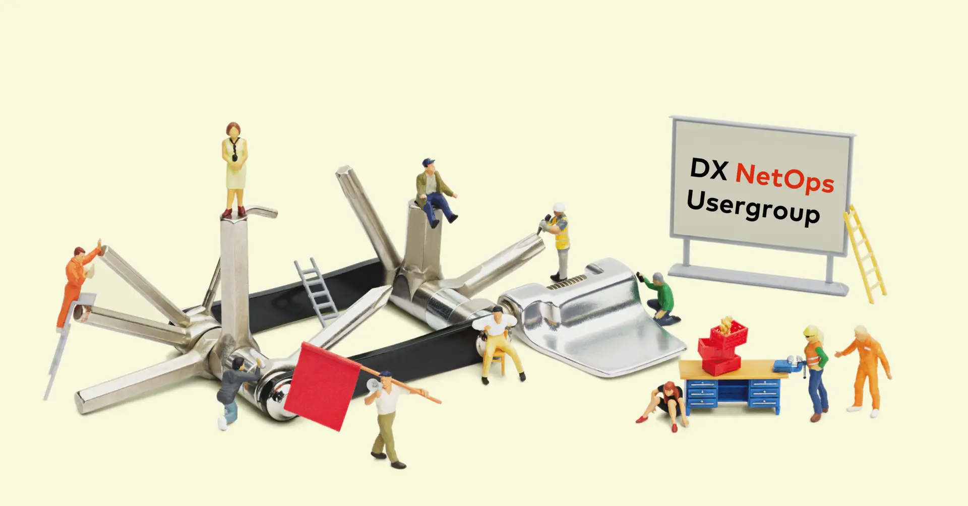 amasol miniature world with a multifunctional tool and a black board saying DX NetOps Usergroup