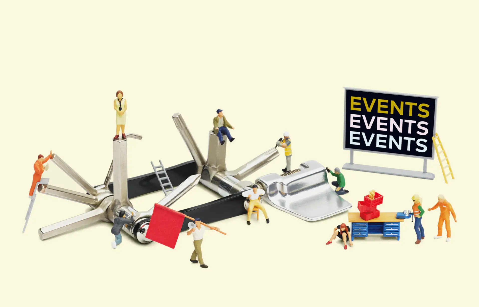 amasol miniature world with a multifunctional tool and a black board saying events