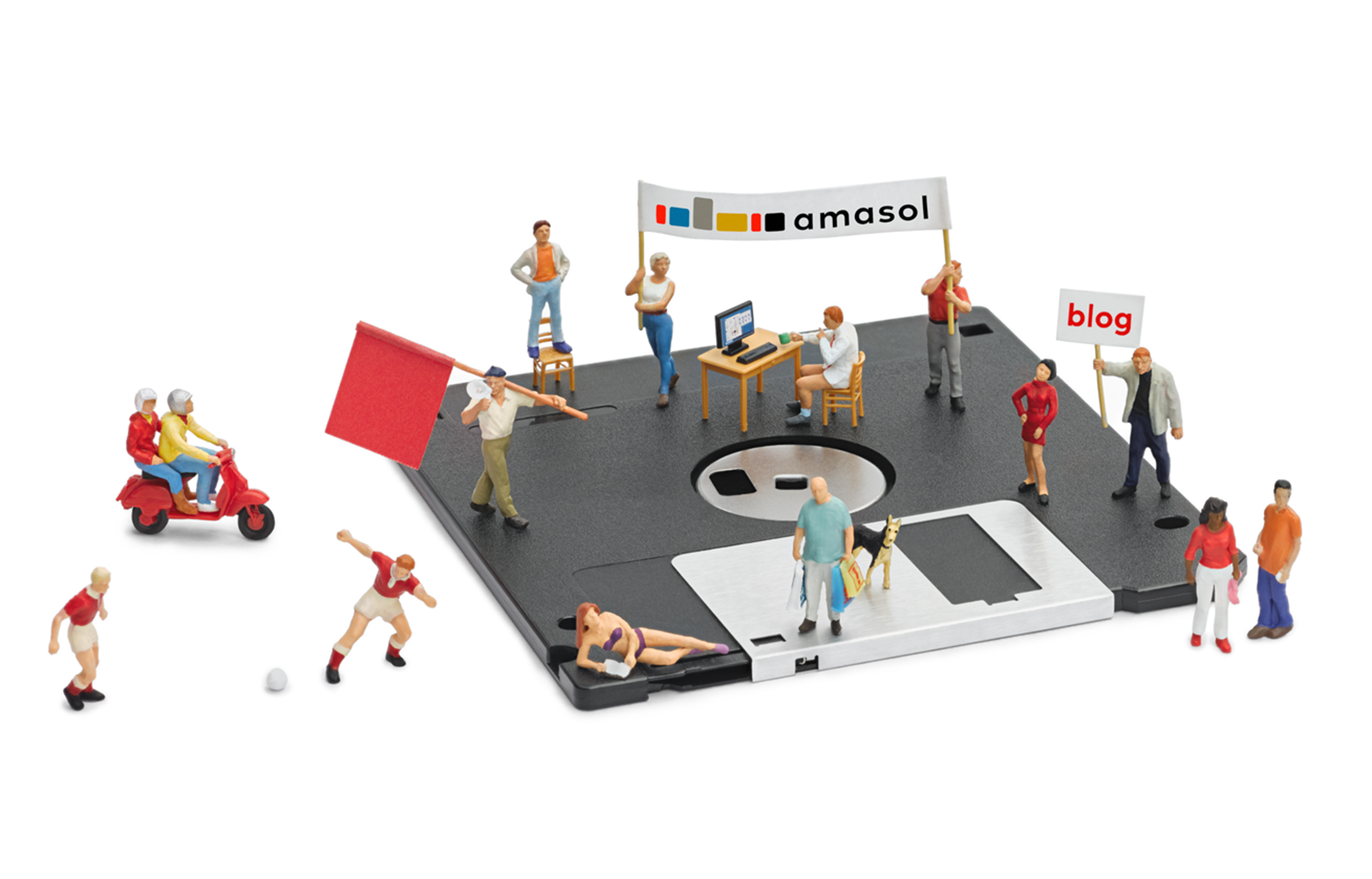 amasol miniature world with a floppy disk and minaiture people. Including a banner with the amasol logo and a banner with the word blog